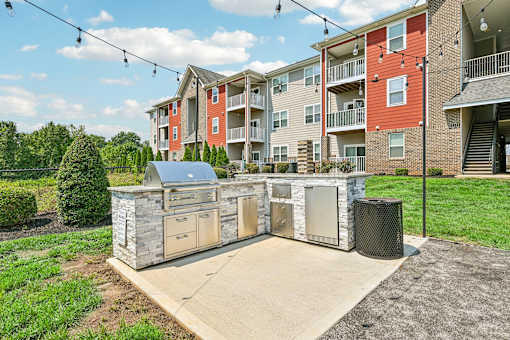 A grill area at Hawks Landing in Hickory NC featuring ambient string lighting for a warm outdoor atmosphere