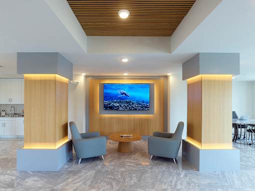 Modern resident clubhouse at Gateway Luxury Apartments in Pompano Beach, featuring stylish lounge areas and contemporary furnishings.