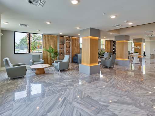 Well-appointed club room interior with multiple seating options and contemporary furnishings.
