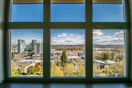 SW Portland, OR, Apartments for Rent - Corbett Heights - Panoramic View of City Skyline with Forests and Mountains in the Background.