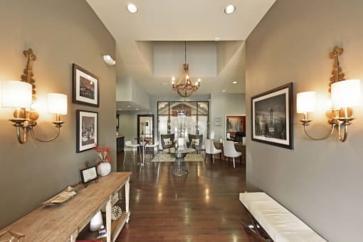 a view of a dining room with a table and chairs in the distance