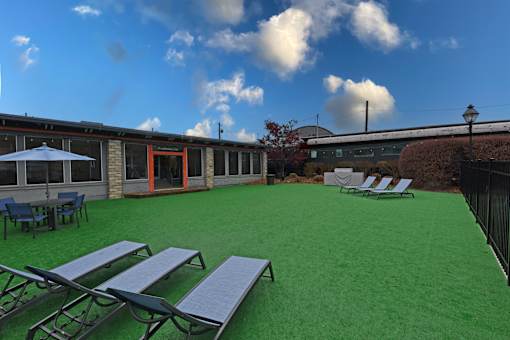 A sunny day at the outdoor seating area with tables and chairs.
