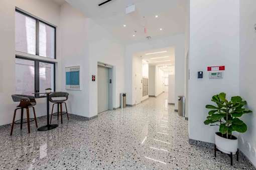 Hallway in a pet-friendly Miami Beach apartment community, featuring clean design, bright lighting, and easy access to residences.