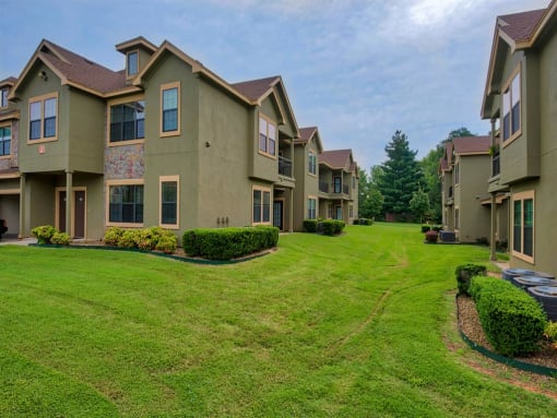 Parc at Rogers apartments surrounded by grass