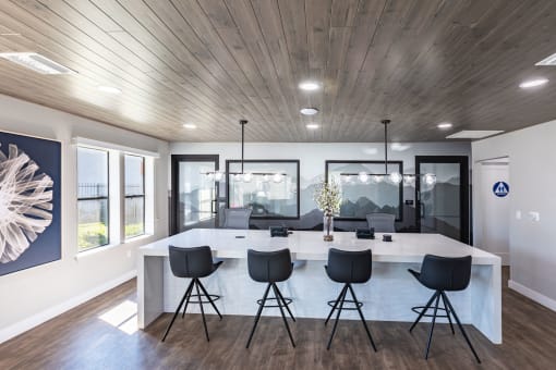 a kitchen and dining room with a large table and chairs