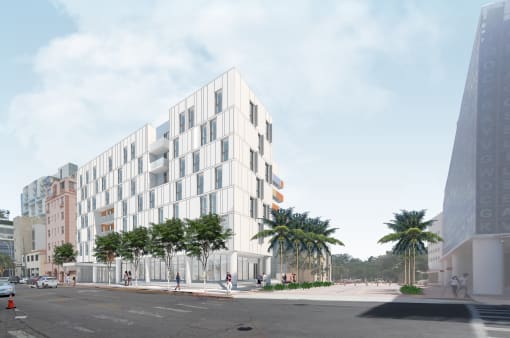 Pet-Friendly Apartments In Miami Beach, FL – The Anamar at Collins Park – a rendering of a white building on a city street