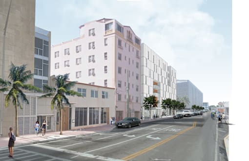 Miami Beach Apartments – The Anamar at Collins Park – a rendering of a pink building on a city street