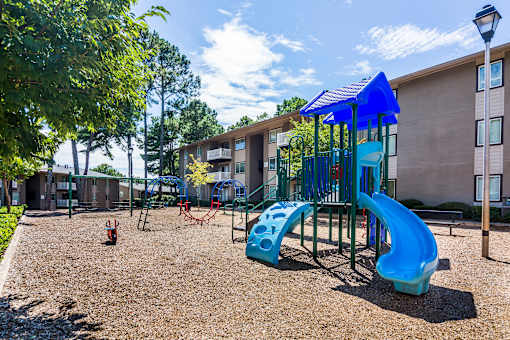 On-site playground with slides and mulch ground at this Atlanta apartment community.
