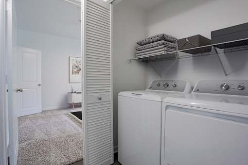A laundry room with a washer and dryer.
