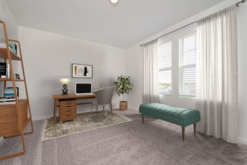 A room with a desk, chair, and a potted plant.