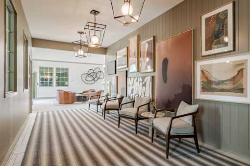 Stylish clubhouse interior and resident lounge entrance at Blue Sky Landing apartments in College Park, GA near Camp Creek Marketplace and Atlanta Airport.