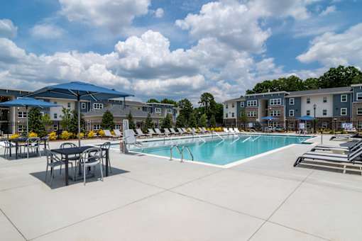 Resort-style swimming pool at Blue Sky Landing apartments in College Park, GA offering pet-friendly 1, 2 and 3 bedroom apartments near South Fulton and Camp Creek Marketplace.