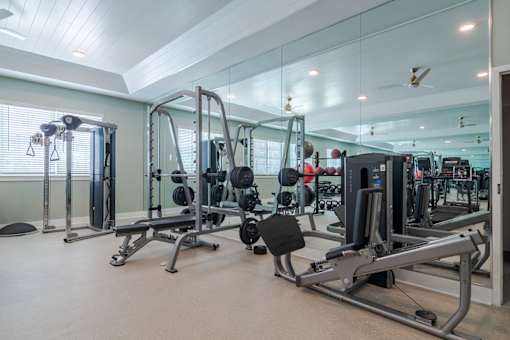 Fully equipped fitness center at Blue Sky Landing apartments in College Park, GA with cardio and strength training equipment near Atlanta Airport and Old National Highway.