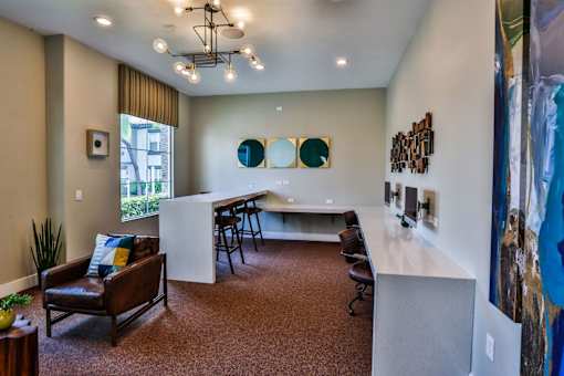 A room with a brown carpet and a brown leather chair.