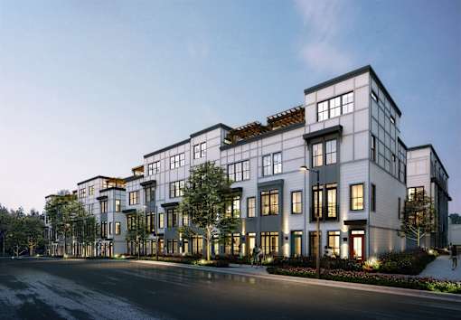 Luxury Atlanta, GA Homes – LaFrance Square – A modern building with a lot of windows and lights on.