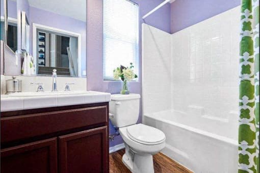 bathroom with wood-style flooring