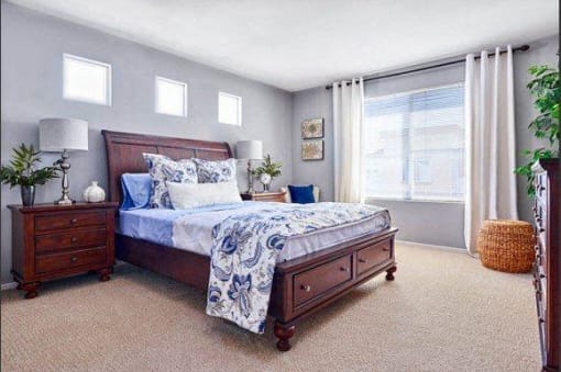 Four-Bedroom Apartments in Tustin, CA - Tustin Cottages - Bedroom with Carpeting, Single Hung Windows, and Matching Bedroom Furniture
