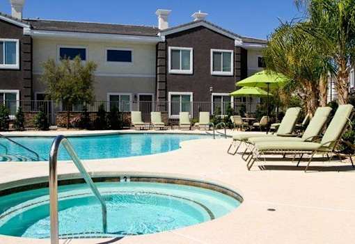 A swimming pool with a ladder in the middle of it.