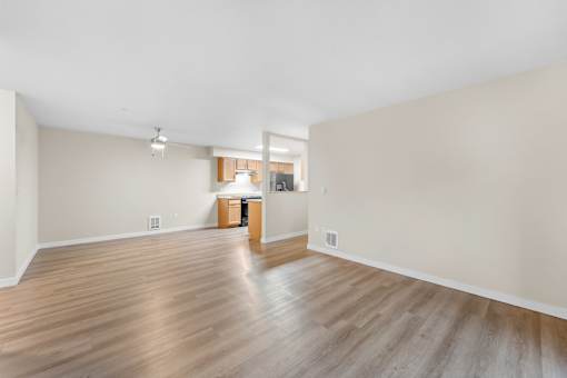 A room with wooden floors and a white ceiling.
