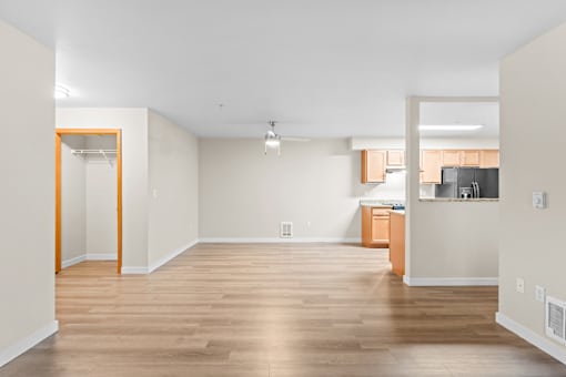 A room with wooden floors and white walls.