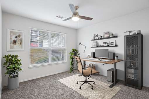 2 & 3-Bedroom Apartments for Rent in Little Rock, AR – Capitol Hill – A room with a desk, chair, and a ceiling fan.