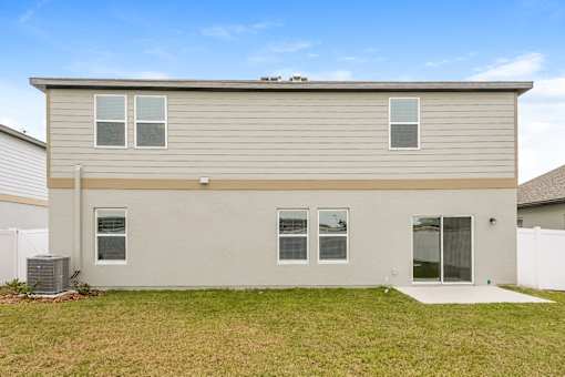 Ruskin, FL Homes - Ruskin Reserve Luxury New Home with Large Driveway and Attached Garage and Large Fenced in Back yard