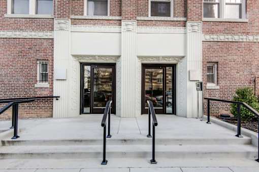 A red brick building with a white entrance.