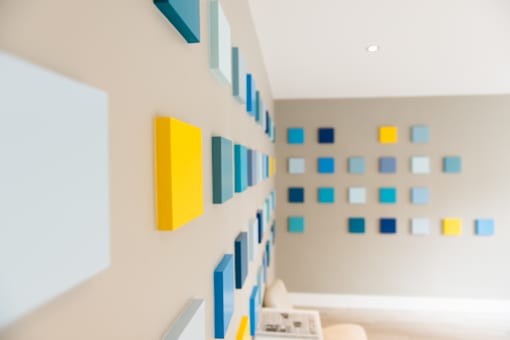 A wall with blue and yellow squares on it.