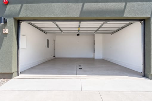 Private two-car attached garage with direct home access at Villas at 91st townhomes in Tolleson, AZ