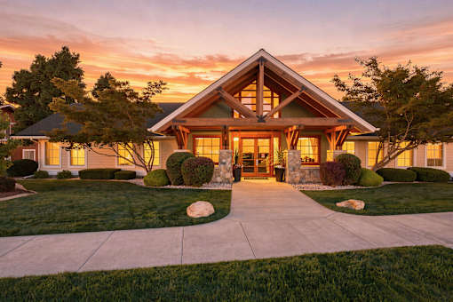 A house with a front yard and a driveway.