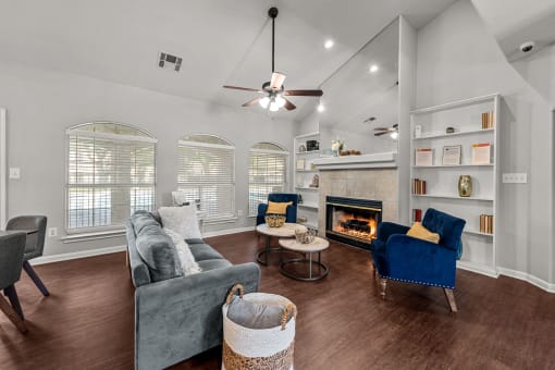 Austin, TX Apartments – Huntington Meadows– clubhouse with couches and chairs and a fireplace
