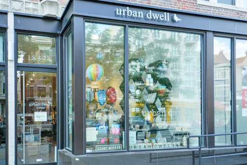 A storefront of Urban Dwell with a large window display.