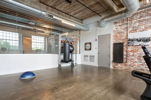 the gym at 625 west 53rd street has a gym floor with a punching bag