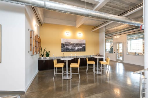 a dining room with a table and chairs