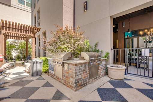A courtyard with a black and white checkered floor.