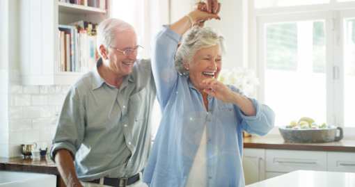 Active 55+ couple enjoying senior apartment living at Sage 5430 in Norcross, GA