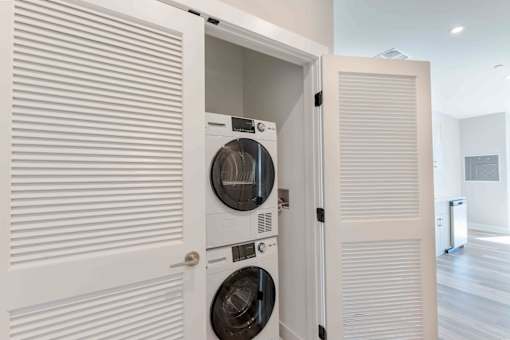 Private laundry closet with full-size washer and dryer included in every unit at Creekline at Fairfield apartments, Fairfield CT.