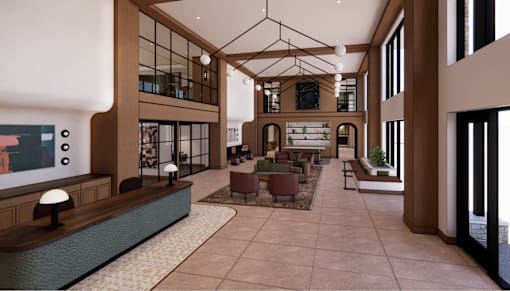 A modern interior with a large open space and a long table.