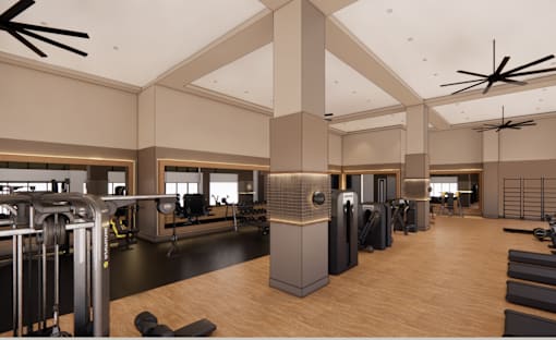 A gym with a variety of equipment including treadmills, weights, and exercise machines.