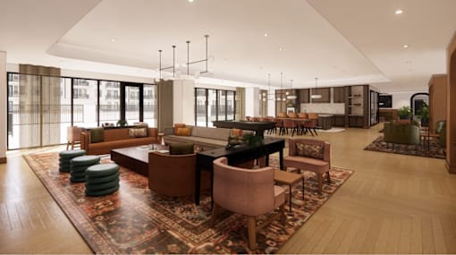 A living room with a rug and a table with chairs.