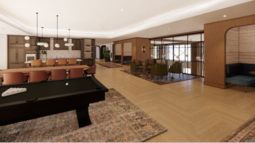 A billiard table is in the middle of a room with a wooden floor and a large window.