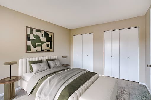 A bedroom with a large bed and a painting on the wall.