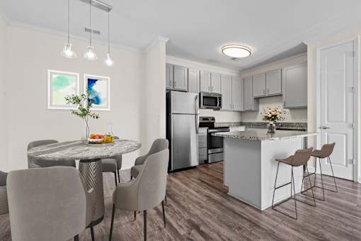 Modern kitchen at Hawks Landing Apartments in Hickory, NC with stainless steel appliances and dining area