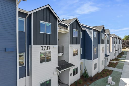 exterior view of a row of multicolored apartment buildings,