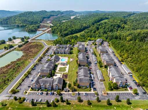 Apartments for Rent in Oak Ridge, TN 37830 – Centennial Village – an aerial view of a neighborhood of houses near water