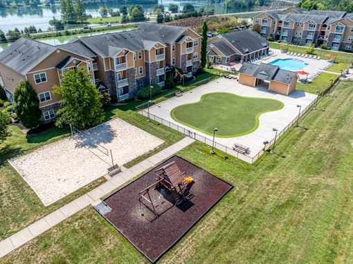 Pet-Friendly Apartments in Oak Ridge, TN – Centennial Village – an aerial view of our apartment complex with view of our pool, putting green, and volleyball court