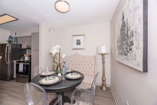 Apartments in Lawrenceville Georgia for Rent – Park on Sweetwater - a dining room with a table and chairs and a kitchen