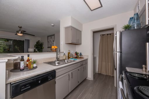 Lawrenceville, GA Apartments – Park on Sweetwater – redesigned kitchen with stainless steel appliances and granite counter tops and a large window