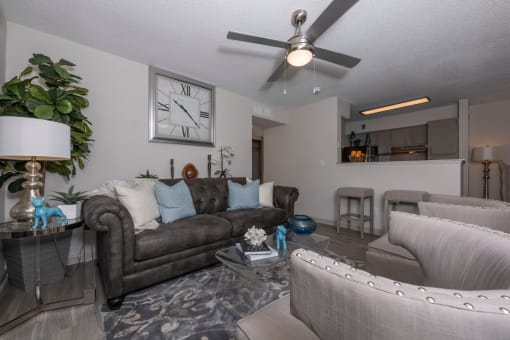 Apartments in Lawrenceville Georgia for Rent – Park on Sweetwater - a living room with couches and chairs and a ceiling fan