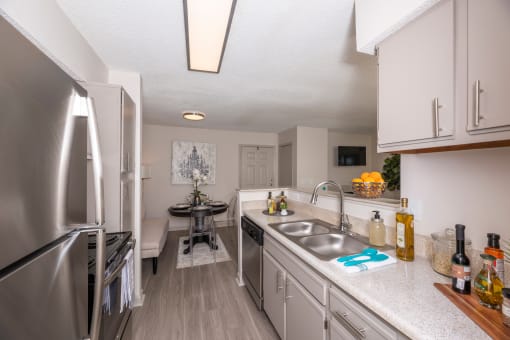 Pet-Friendly Apartments in Lawrenceville– Park on Sweetwater – a renovated kitchen with stainless steel appliances and white cabinets